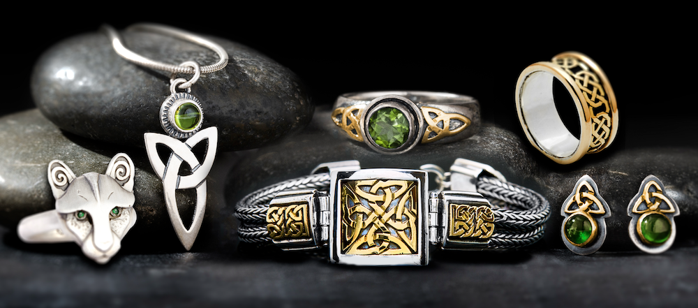 A display of handcrafted artisan Celtic jewelry in sterling silver and 14K and 18K gold. From pendants and necklaces to rings, earrings, and bracelets, each pieces features delicate Celtic knotwork and Celtic symbolism in precious metals.